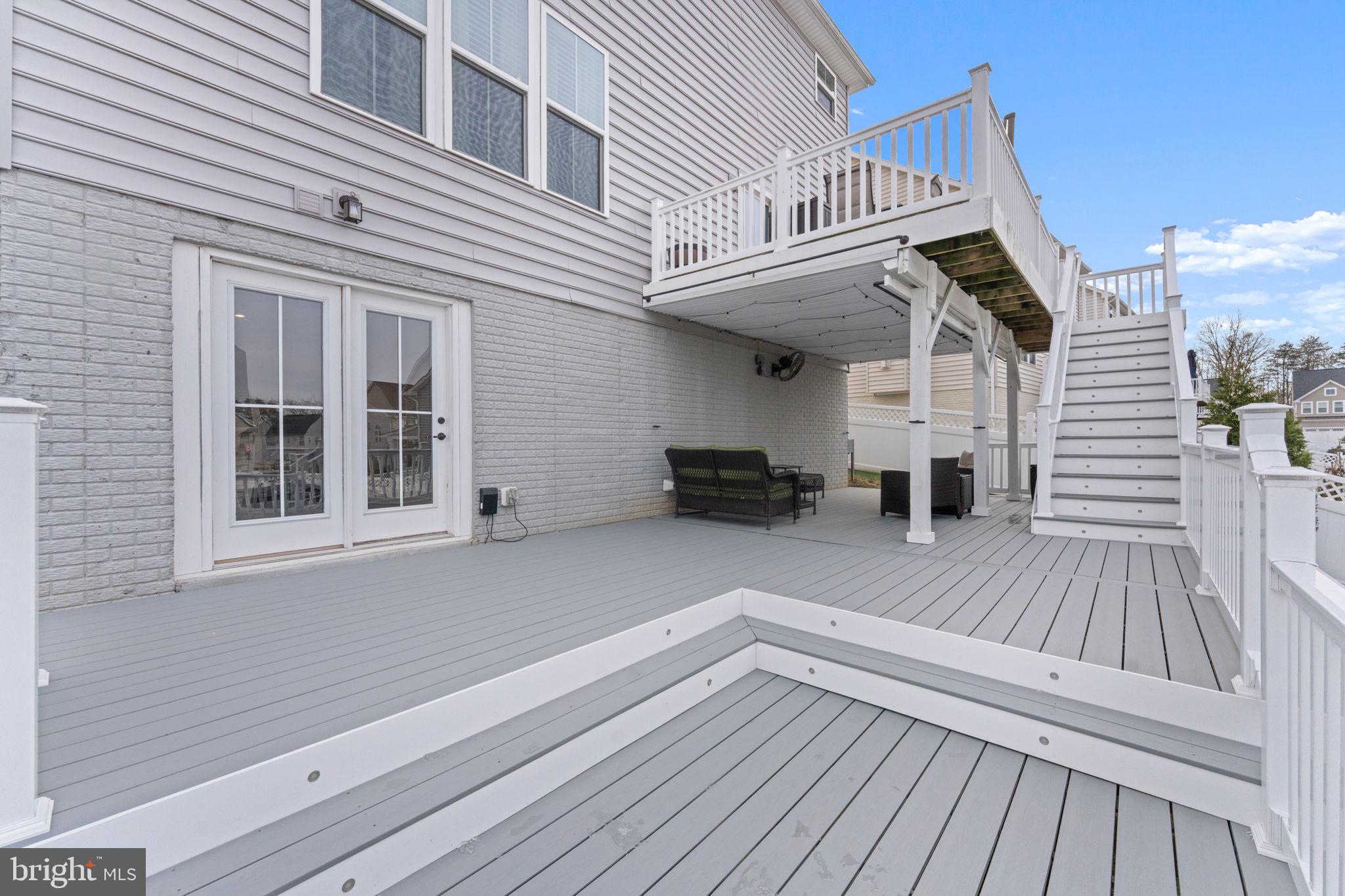 12432 Mays Quarter Road Woodbridge, VA 22192 - Photo 81 of 94 a view of outdoor space with deck and flat screen tv