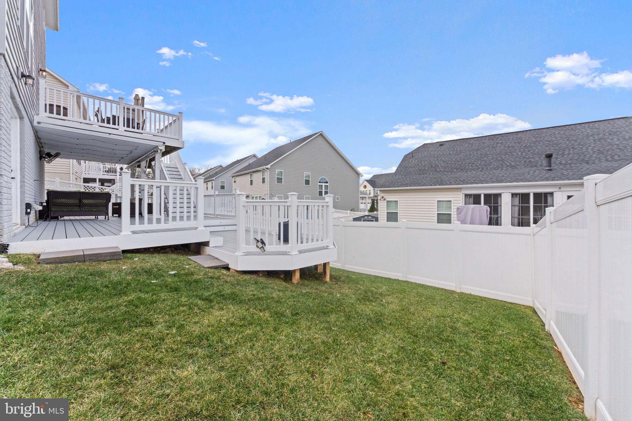 12432 Mays Quarter Road Woodbridge, VA 22192 - Photo 87 of 94 a front view of a house with a garden and yard