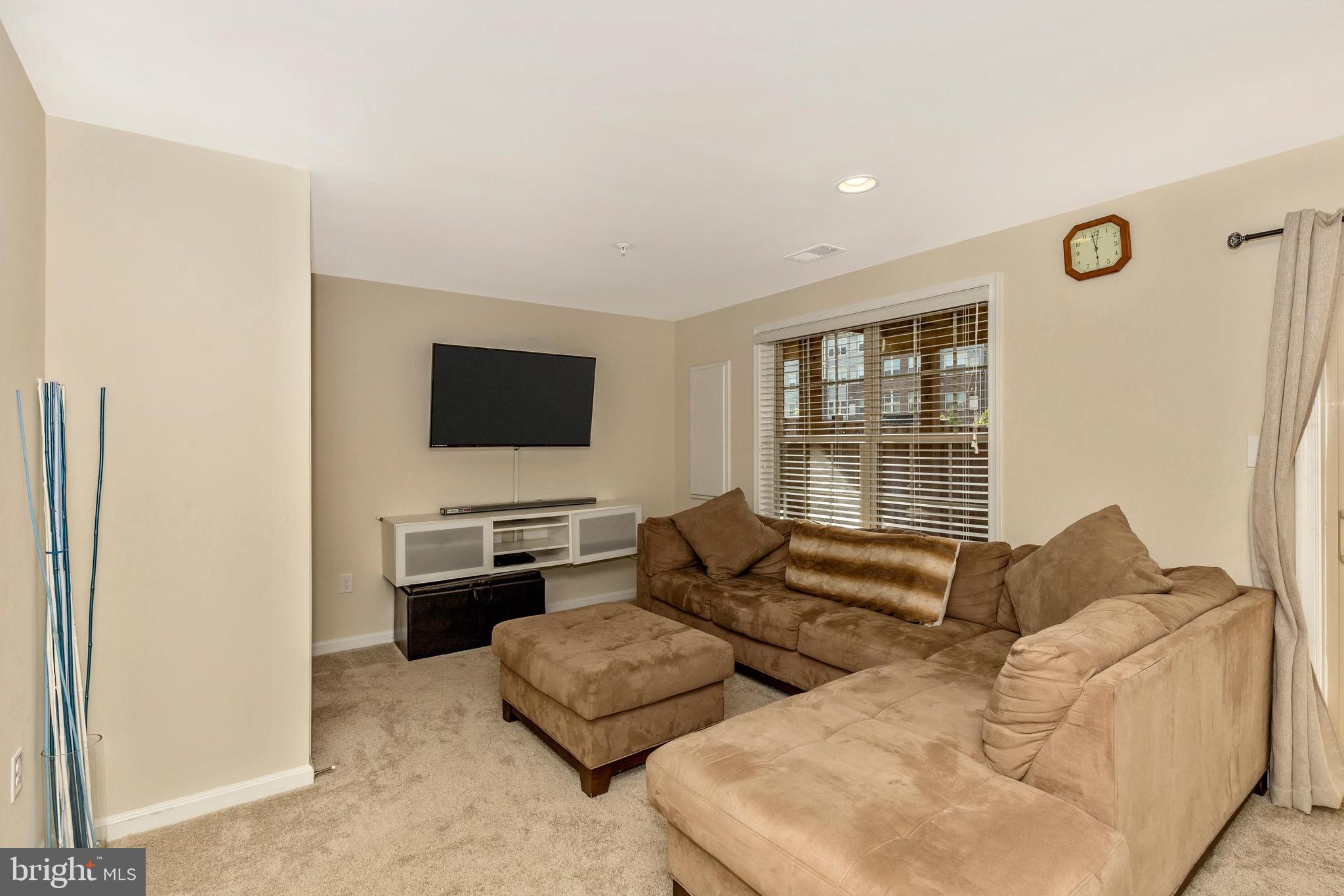 4730 Cambria Road Frederick, MD 21703 - Photo 27 of 42 Lower level family/media room open to fenced yard