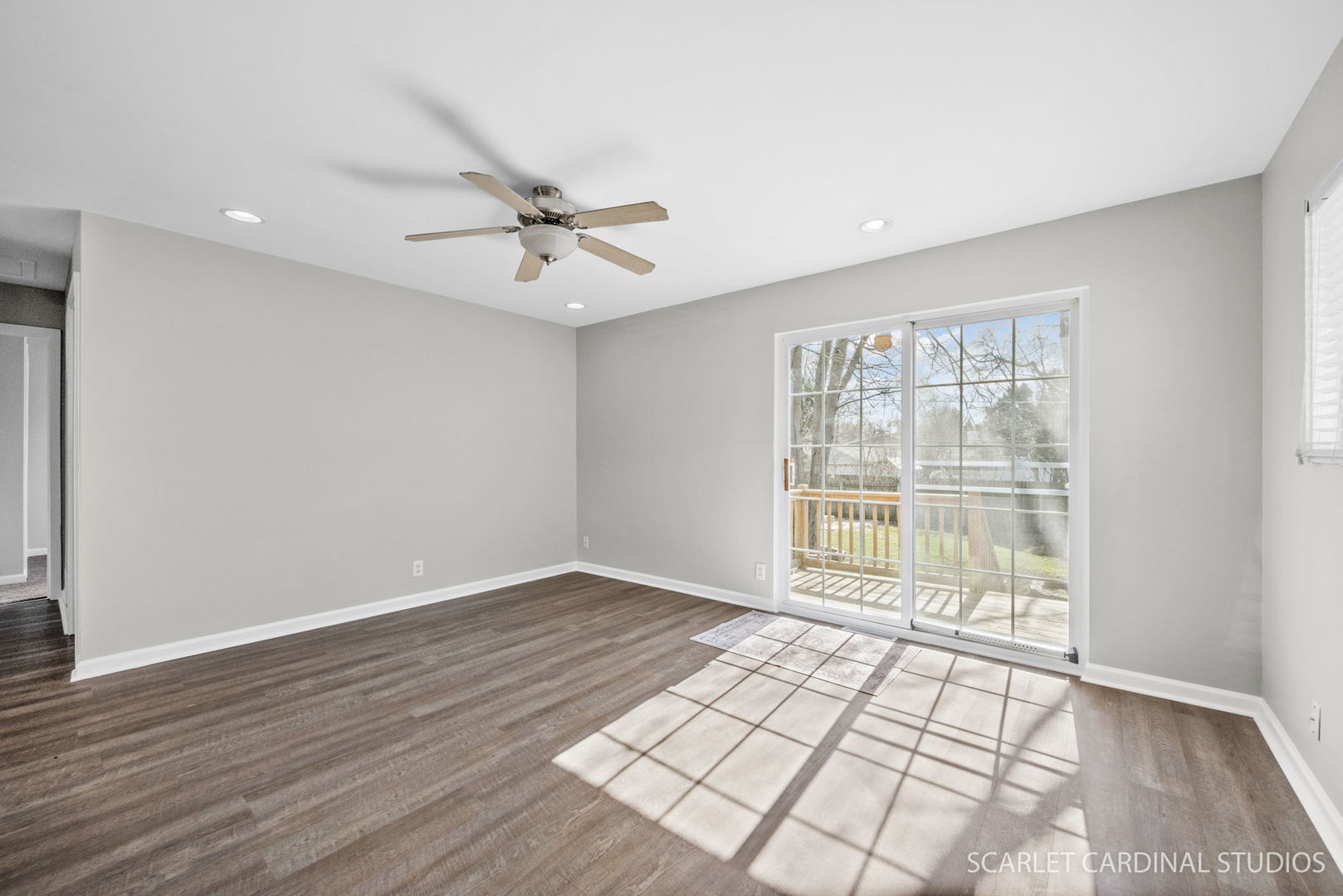 27 Long Beach Road Montgomery, IL 60538 - Photo 5 of 18 a view of an empty room with a window and wooden floor