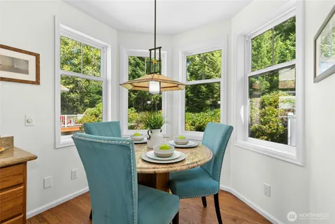 a view of a dining room with furniture window and outside view