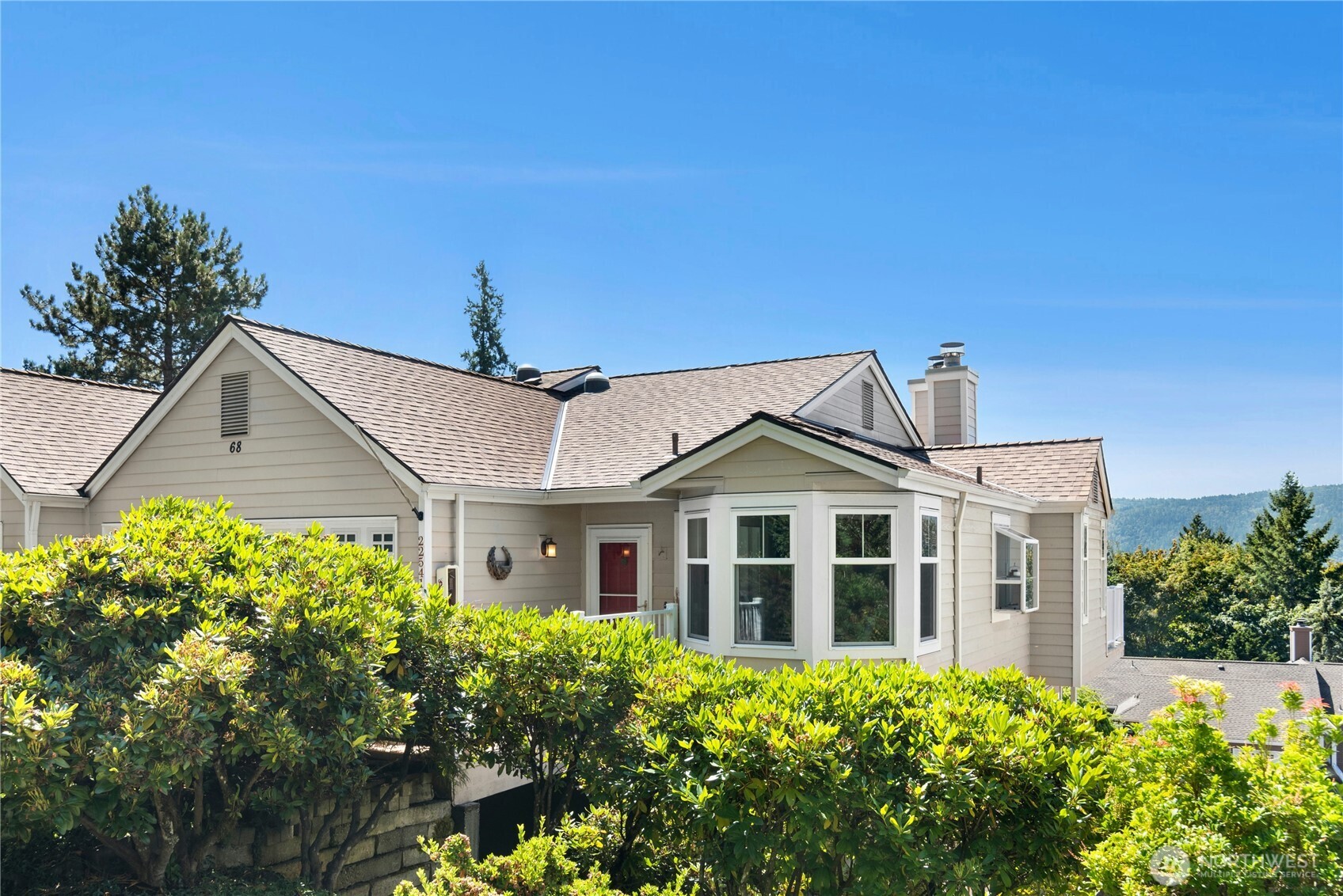 22541 Southeast 42nd Court, Unit 2252 Issaquah, WA 98029 - Photo 2 of 37 a front view of a house with a yard