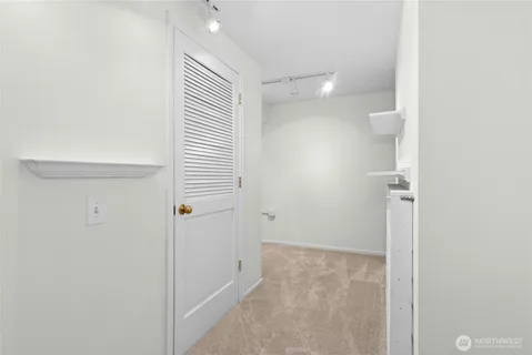 a bathroom with a shower and a glass door