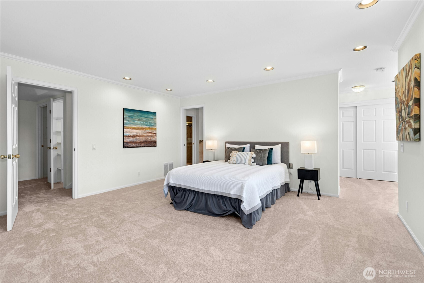 22541 Southeast 42nd Court, Unit 2252 Issaquah, WA 98029 - Photo 23 of 37 a spacious bedroom with a bed and a painting