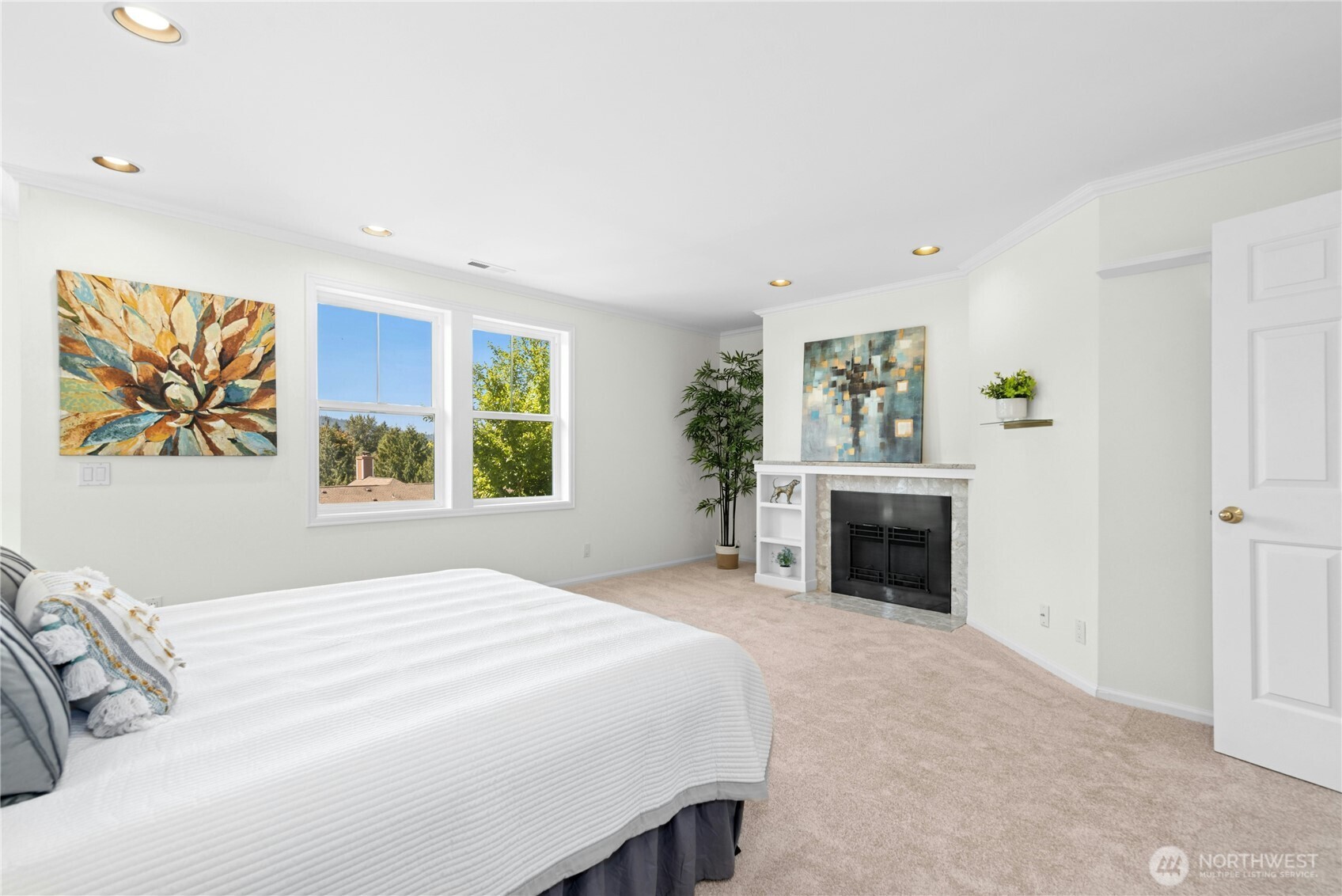 22541 Southeast 42nd Court, Unit 2252 Issaquah, WA 98029 - Photo 24 of 37 a spacious bedroom with a bed and a window