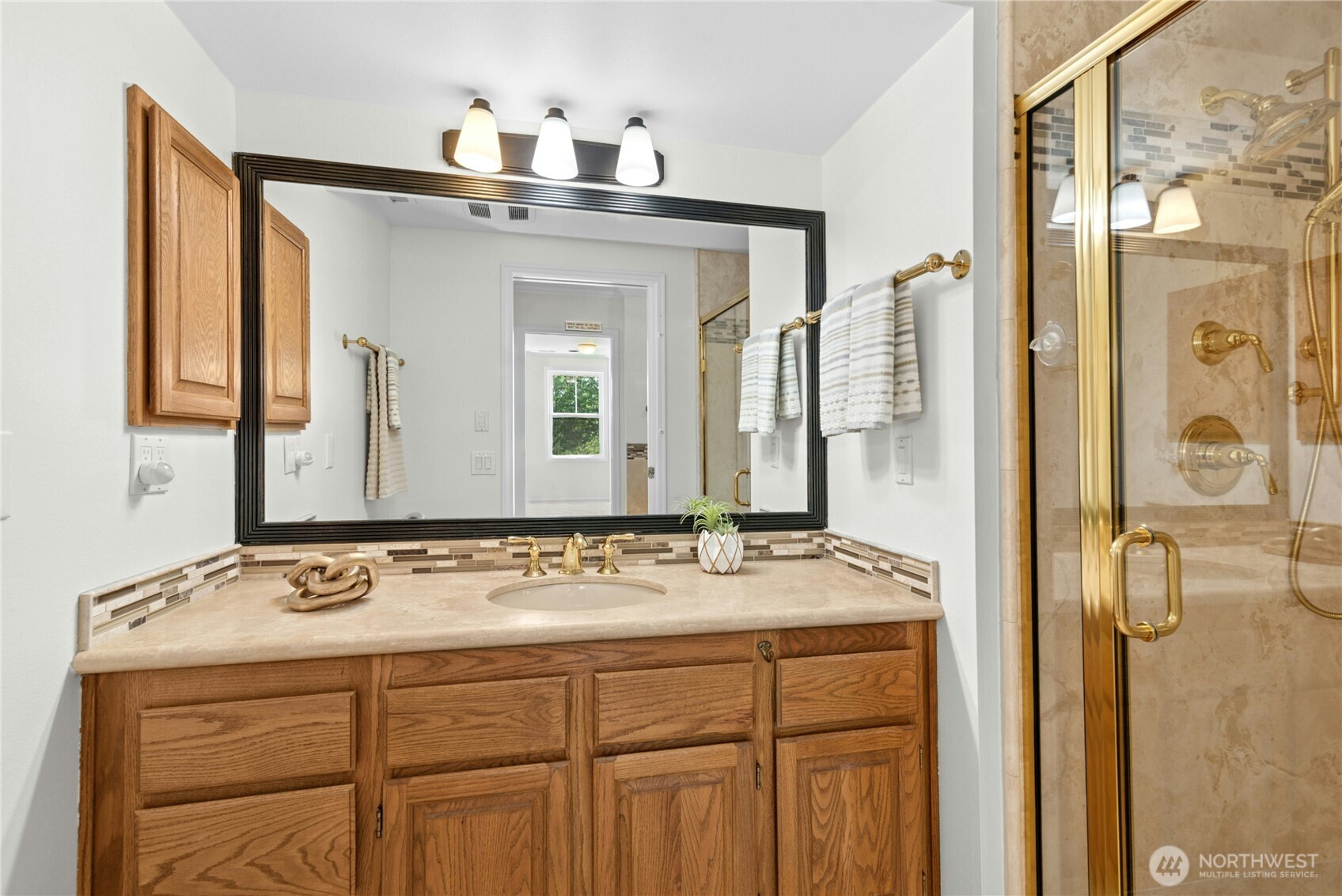 22541 Southeast 42nd Court, Unit 2252 Issaquah, WA 98029 - Photo 26 of 37 a bathroom with a sink and a mirror