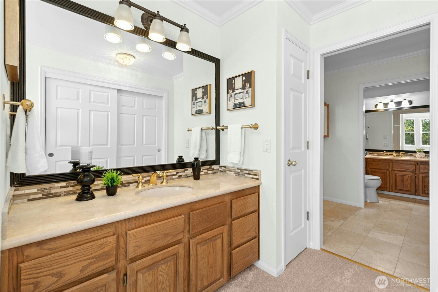 22541 Southeast 42nd Court, Unit 2252 Issaquah, WA 98029 - Photo 27 of 37 a bathroom with a sink and a mirror