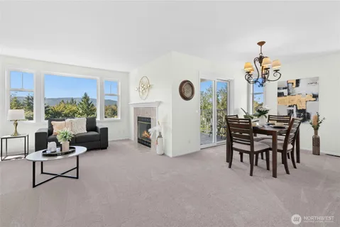 a living room with furniture and a clock
