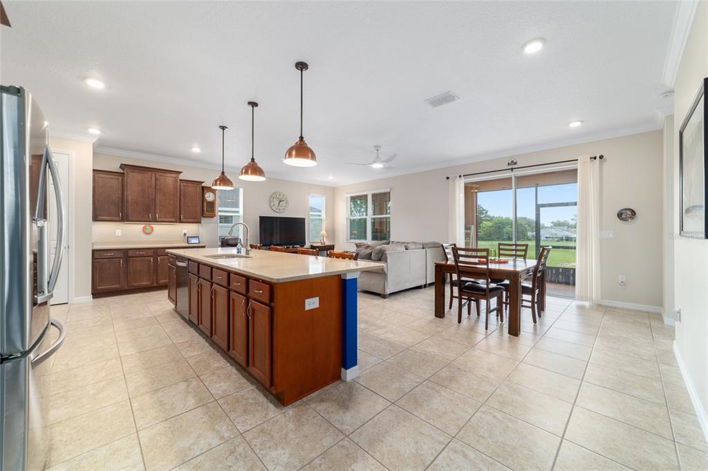 9236 Southwest 91st Ct Road Ocala, FL 34481 - Photo 16 of 48 a large kitchen with a large counter top and stainless steel appliances