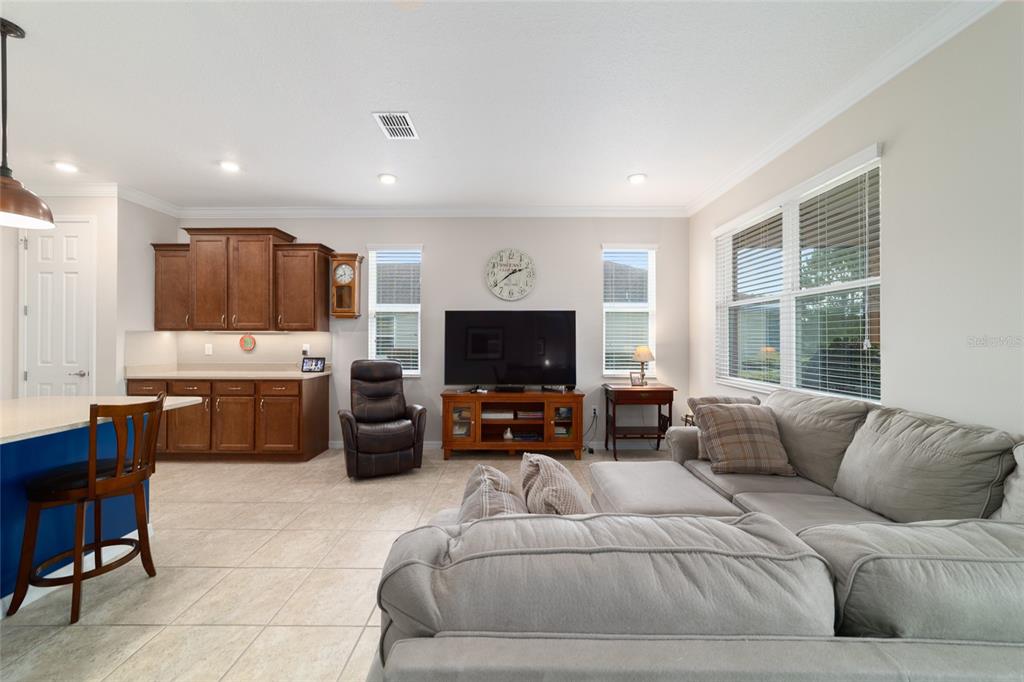 9236 Southwest 91st Ct Road Ocala, FL 34481 - Photo 19 of 48 a living room with furniture and a flat screen tv