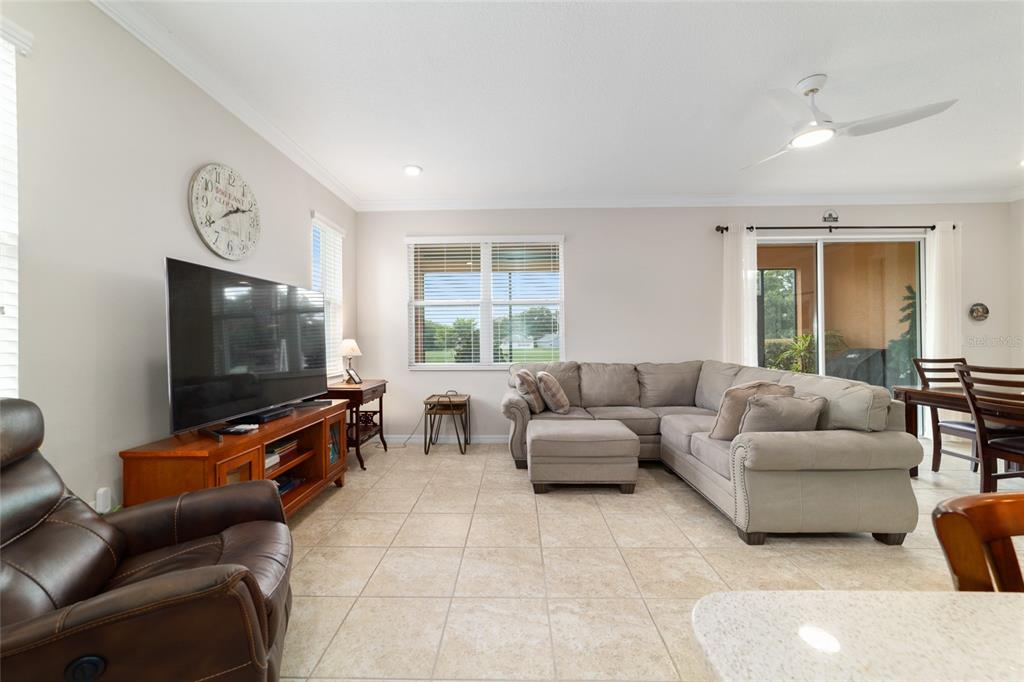 9236 Southwest 91st Ct Road Ocala, FL 34481 - Photo 20 of 48 a living room with furniture and a flat screen tv