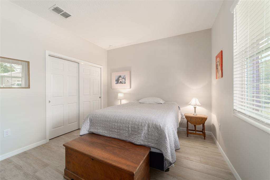 9236 Southwest 91st Ct Road Ocala, FL 34481 - Photo 34 of 48 a bedroom with a bed and a window