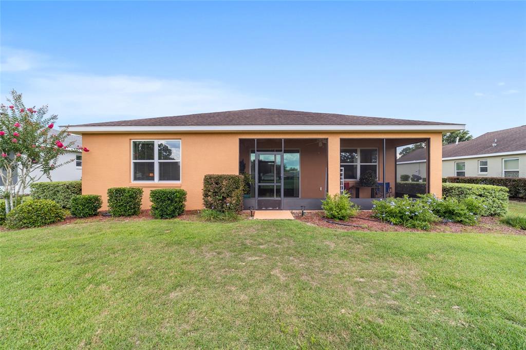 9236 Southwest 91st Ct Road Ocala, FL 34481 - Photo 42 of 48 front view of a house with a yard