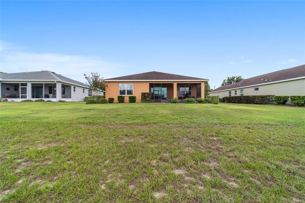 9236 Southwest 91st Ct Road Ocala, FL 34481 - Photo 48 of 48 a view of a house with a big yard and large trees