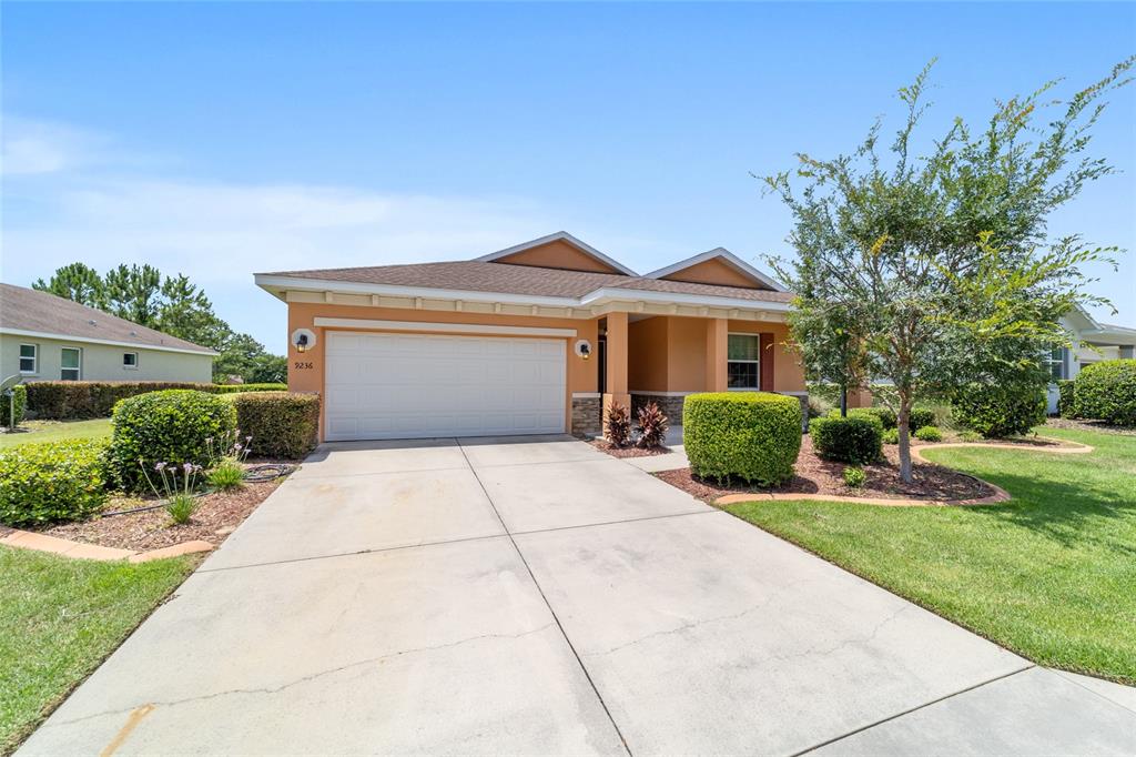 9236 Southwest 91st Ct Road Ocala, FL 34481 - Photo 7 of 48 front view of a house with a yard