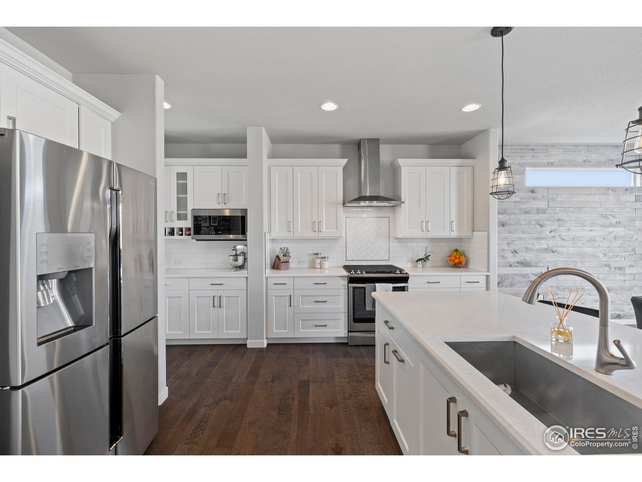 7142 Cottage Court Timnath, CO 80547 - Photo 10 of 29 Gas Range with Vent Hood