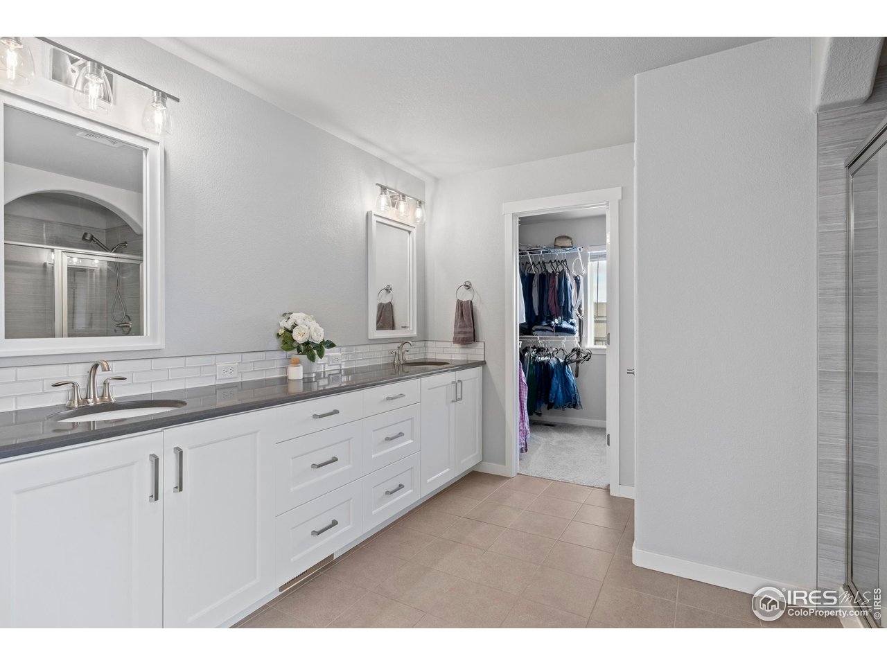 7142 Cottage Court Timnath, CO 80547 - Photo 19 of 29 Large Primary Bathroom with plenty of storage, linen closet and counter space