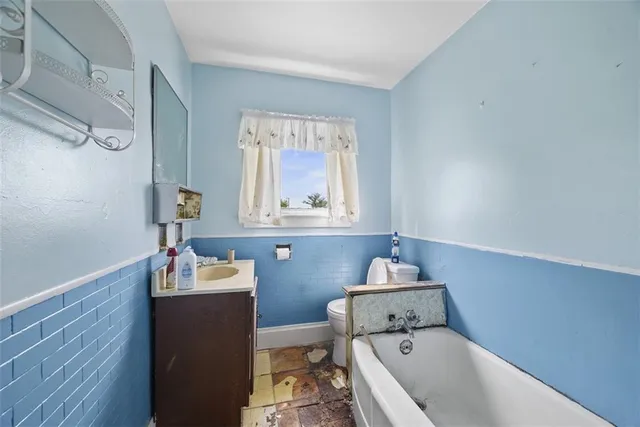 a bedroom with a bed and cabinets