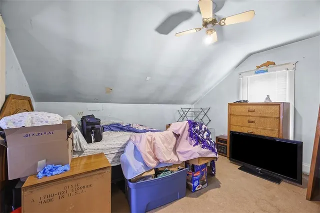 a bedroom with a bed and window