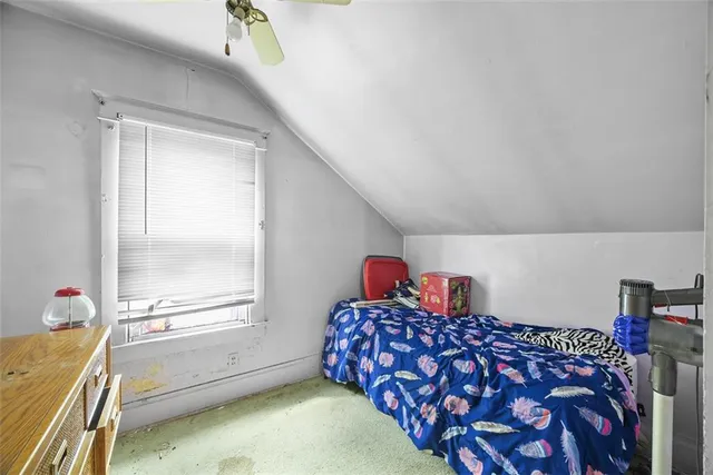 a view of a house with a yard and deck