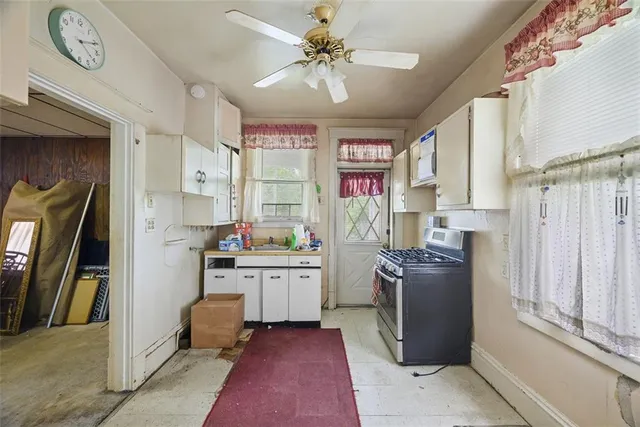 a view of a hallway with elevator and furniture
