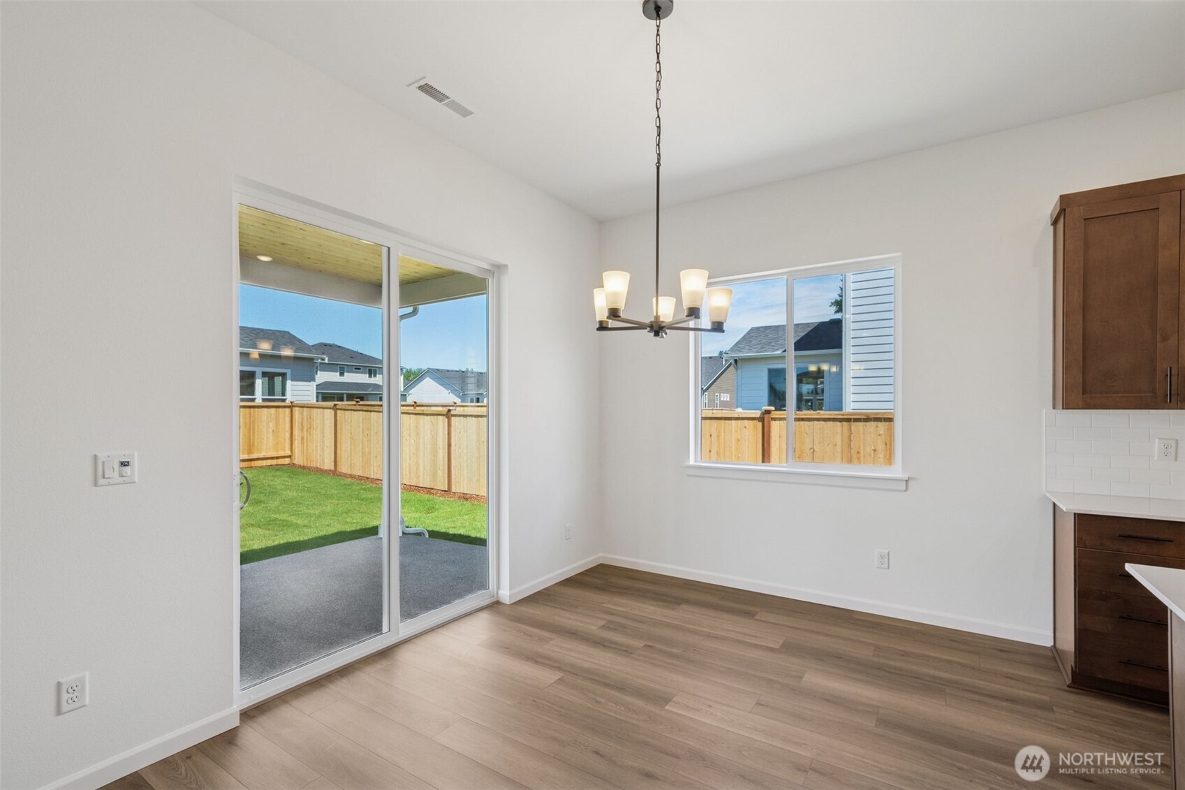 932 Lucas Avenue, Unit 21 Buckley, WA 98321 - Photo 19 of 30 a view of empty room with wooden floor and fireplace