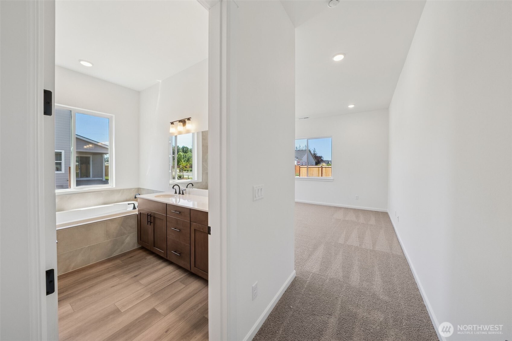 932 Lucas Avenue, Unit 21 Buckley, WA 98321 - Photo 24 of 30 a view of hallway with wooden floor and staircase