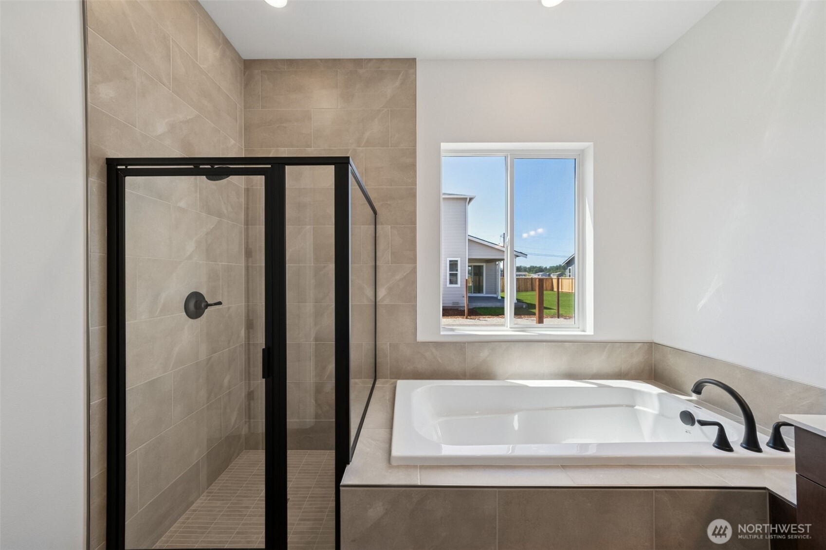 932 Lucas Avenue, Unit 21 Buckley, WA 98321 - Photo 26 of 30 a bathroom with a bathtub and a shower