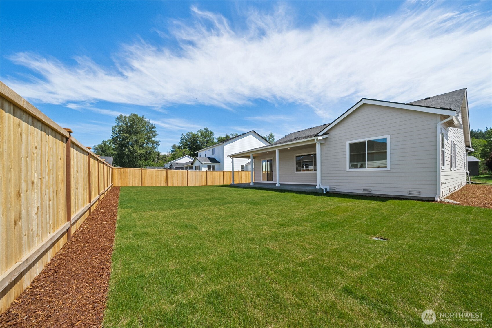 932 Lucas Avenue, Unit 21 Buckley, WA 98321 - Photo 30 of 30 a view of a backyard with a garden