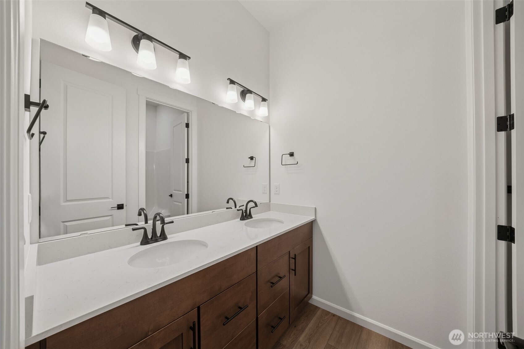 932 Lucas Avenue, Unit 21 Buckley, WA 98321 - Photo 8 of 30 a bathroom with a sink double vanity and a mirror