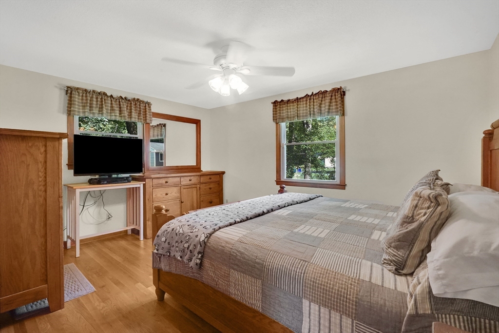 19 Ruthven Street Springfield, MA 01128 - Photo 11 of 19 a bedroom with a bed and a flat screen tv