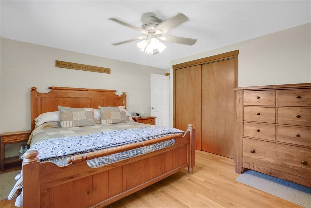 19 Ruthven Street Springfield, MA 01128 - Photo 12 of 19 a bedroom with a bed and a dresser