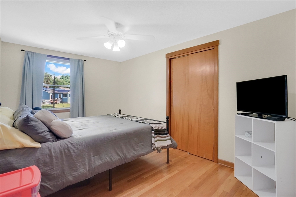 19 Ruthven Street Springfield, MA 01128 - Photo 13 of 19 a bedroom with a bed and a flat screen tv