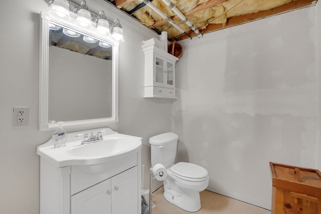 19 Ruthven Street Springfield, MA 01128 - Photo 14 of 19 a bathroom with a sink a toilet and shower