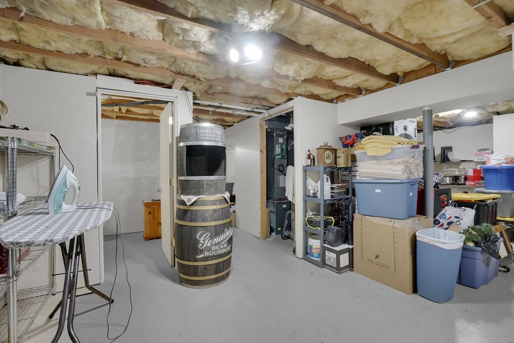 19 Ruthven Street Springfield, MA 01128 - Photo 15 of 19 a storage room with washer and dryer