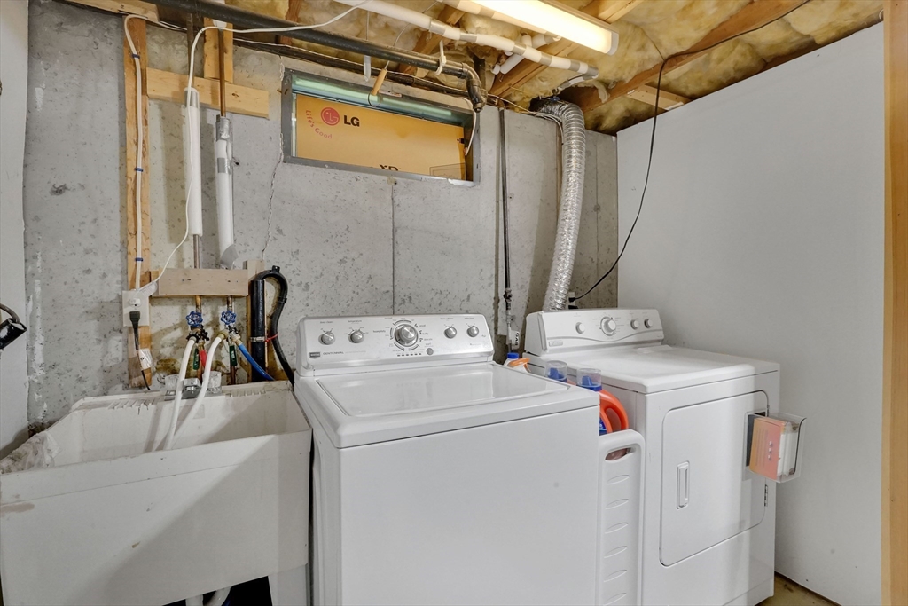 19 Ruthven Street Springfield, MA 01128 - Photo 16 of 19 a utility room with dryer and washer