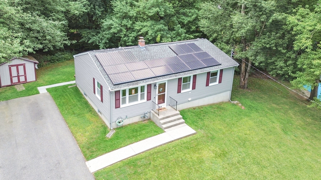 19 Ruthven Street Springfield, MA 01128 - Photo 2 of 19 a aerial view of a house next to a big yard and large trees