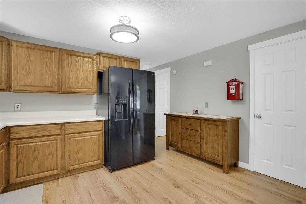 19 Ruthven Street Springfield, MA 01128 - Photo 8 of 19 a kitchen with stainless steel appliances granite countertop a refrigerator and a stove top oven