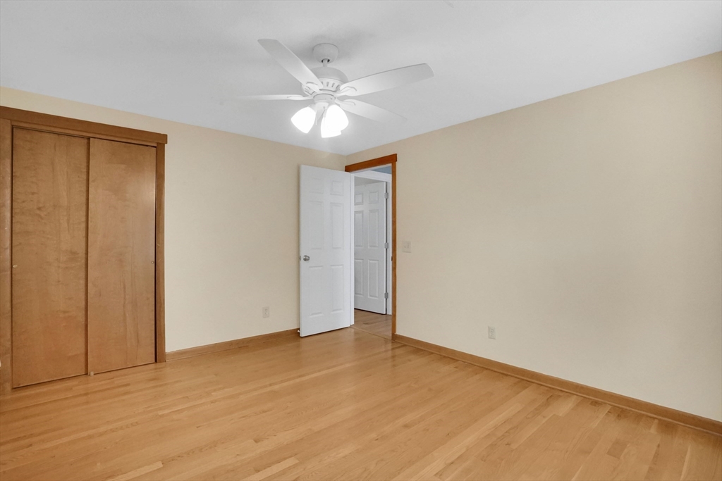 19 Ruthven Street Springfield, MA 01128 - Photo 10 of 19 a view of an empty room and wooden floor