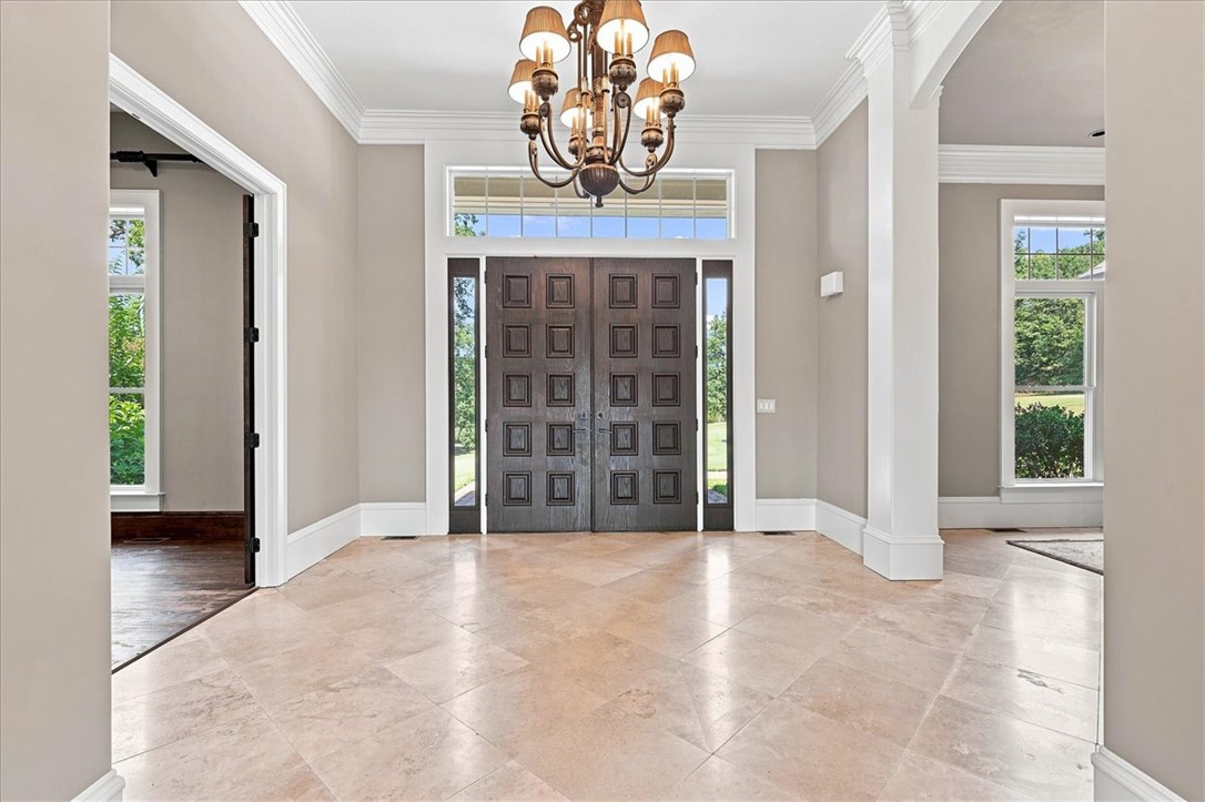 181 Sentell Road Williamston, SC 29697 - Photo 2 of 46 14 foot ceiling and timeless travertine tile flooring define this elegant entrance foyer.