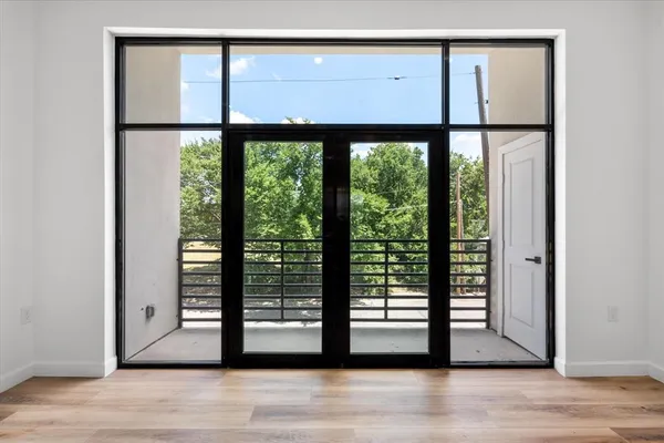 a view of a large window with wooden floor