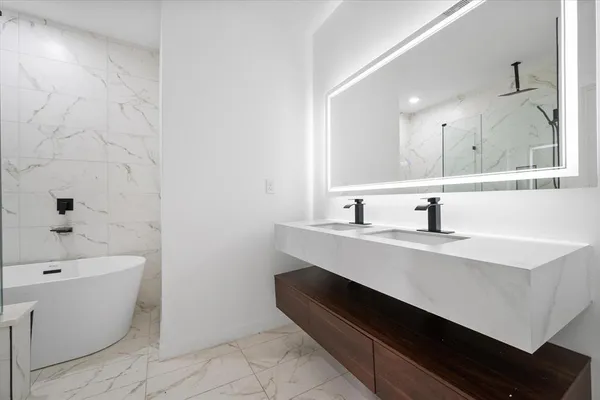 a bathroom with a sink and a bathtub