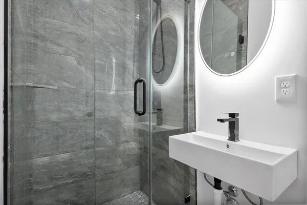 a bathroom with a sink and a mirror