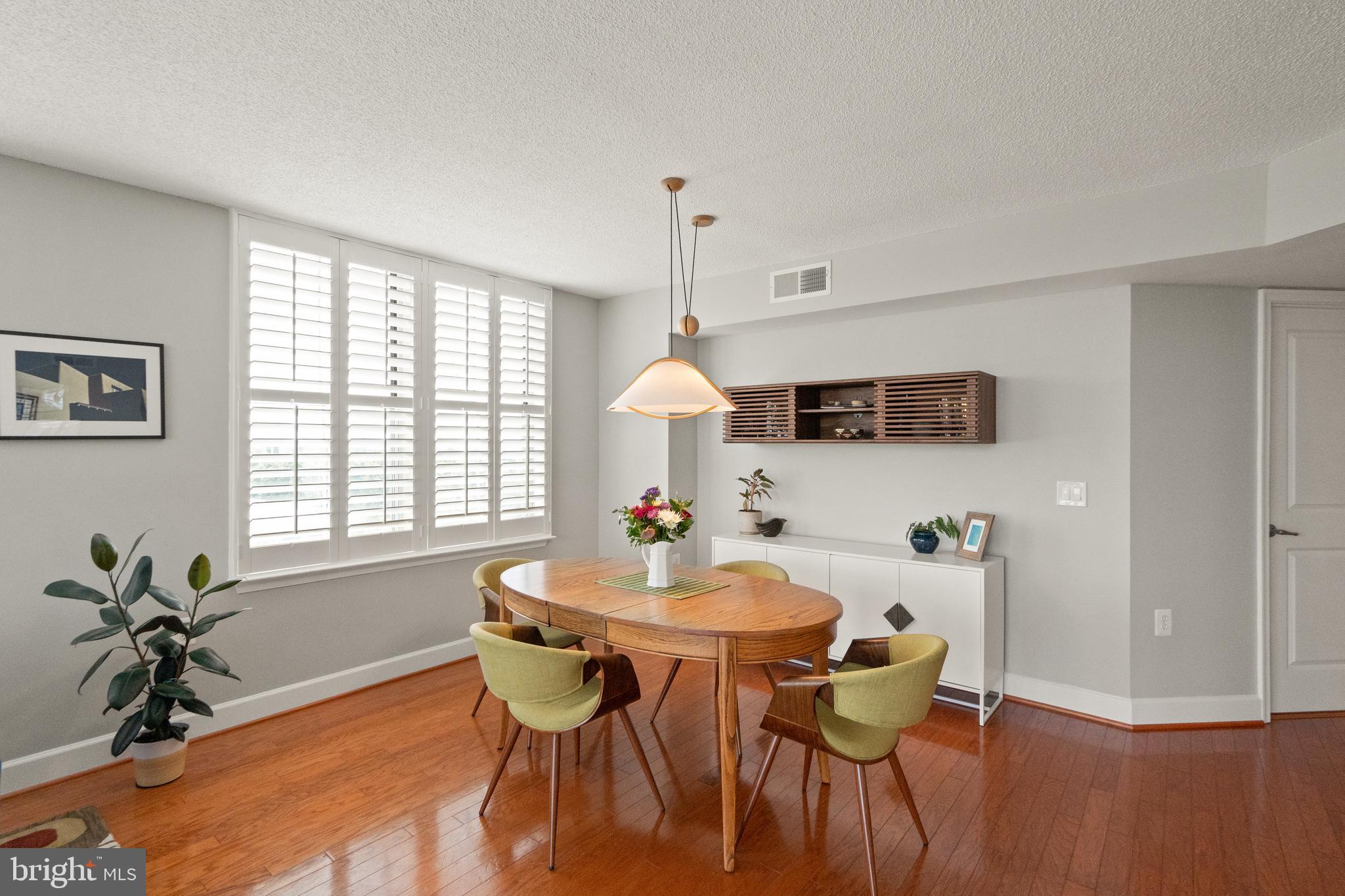 11800 Sunset Hills Road, Unit 1120 Reston, VA 20190 - Photo 13 of 61 Dining area with beautiful light fixture