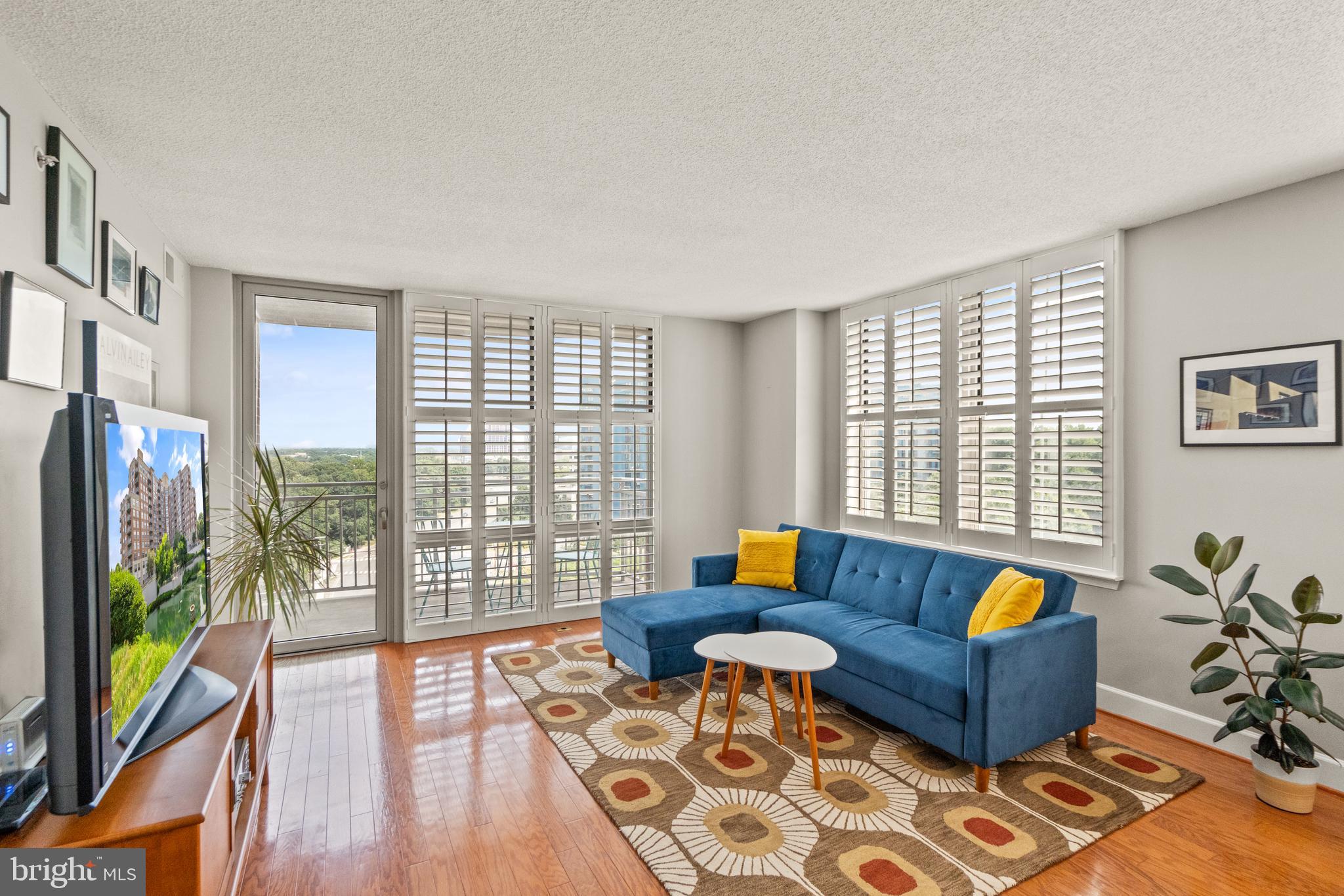 11800 Sunset Hills Road, Unit 1120 Reston, VA 20190 - Photo 15 of 61 Floor to ceiling windows and door to balcony