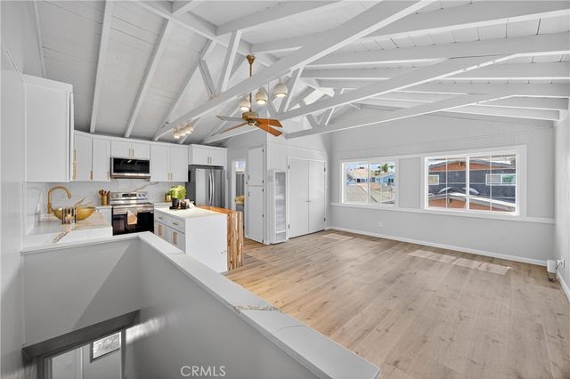 a view of a kitchen with furniture and a window