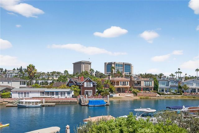 a view of a lake with boats and trees in the background