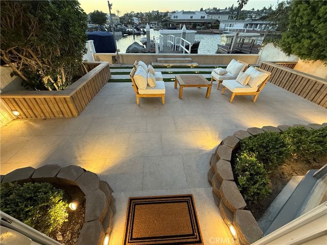 swimming pool view with a seating space