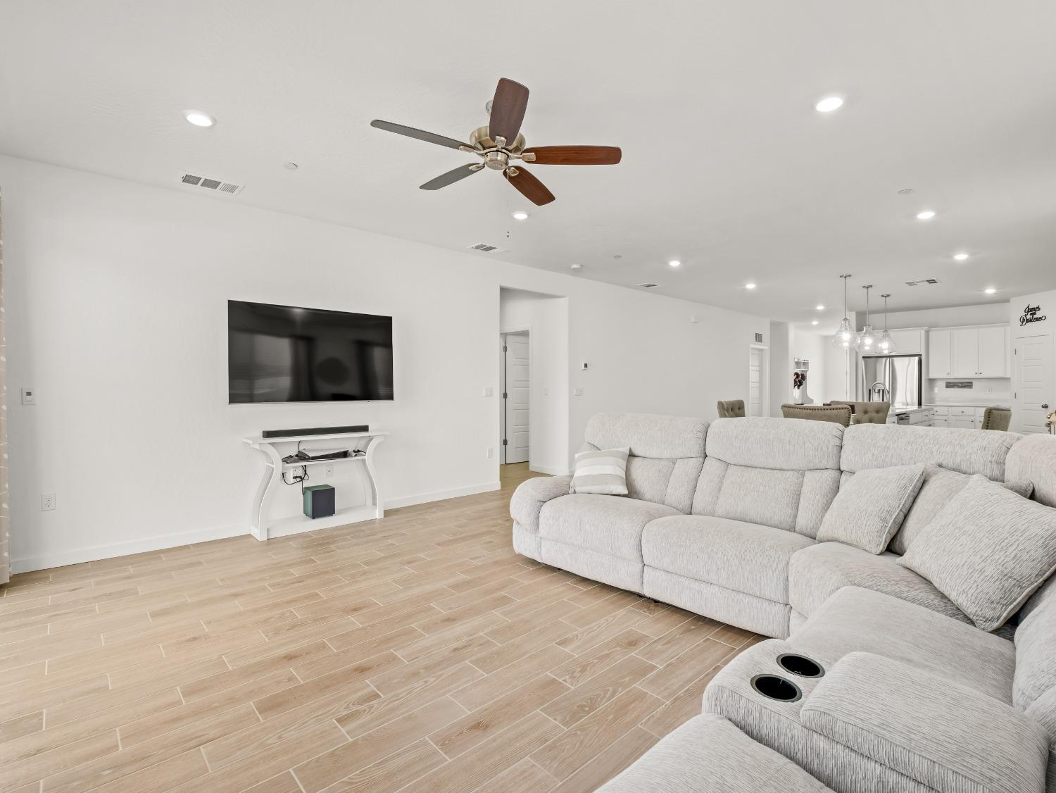 2682 Highland Avenue Clovis, CA 93619 - Photo 11 of 29 a living room with furniture and a flat screen tv