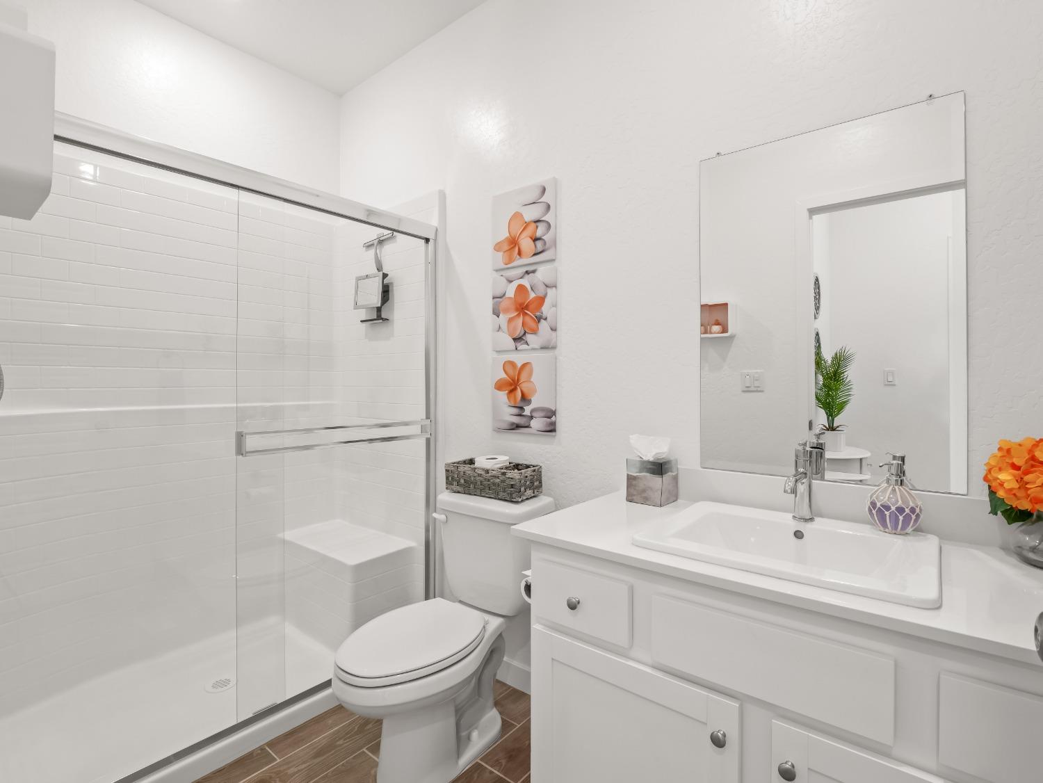 2682 Highland Avenue Clovis, CA 93619 - Photo 15 of 29 a bathroom with a sink toilet and shower